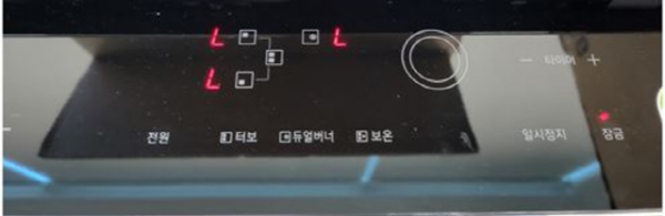 L 표시가 나타난 인덕션 조작부 이미지